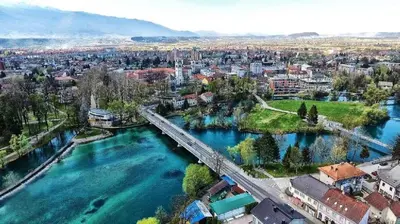 an aerial view of a city with a bridge over a river at Apartment Alma in Bihać