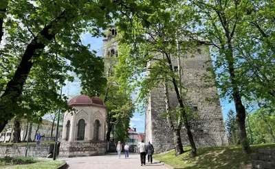 a group of people walking in front of a building at Apartment Alma in Bihać