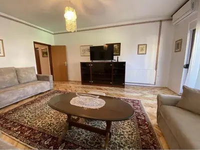 a living room with a couch and a coffee table at Apartment Alma in Bihać