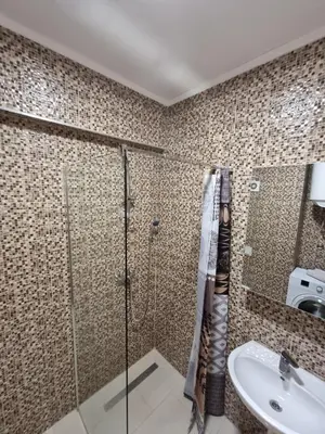 a bathroom with a shower and a sink at Apartman Rita in Fojnica