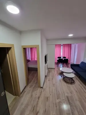 a living room with a couch and a table at Apartman Rita in Fojnica