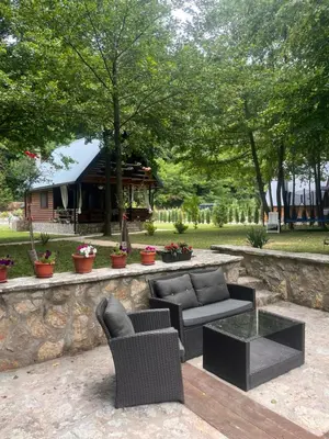 a patio with furniture and a gazebo at Holiday Home UnaPark in Krakovo