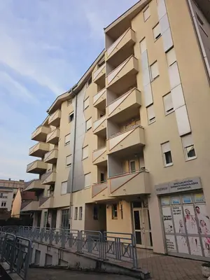 a large apartment building next to a river at Apartman City One in Banja Luka
