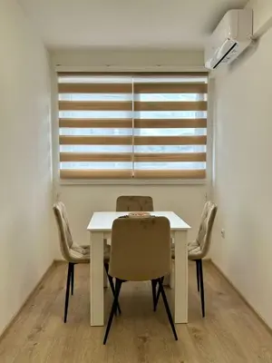 a dining room with a white table and chairs at Jelena in Jajce