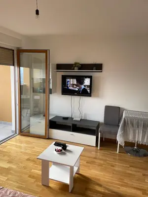 a living room with a tv on a wall at Oaza 3 in Doboj