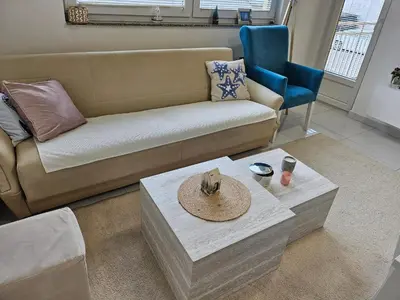 a living room with a couch and a table at Apartman Sunce in Bosanska Gradiška