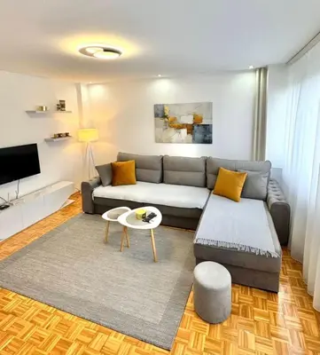 a living room with a couch and a table at Apartman Tanja in Banja Luka