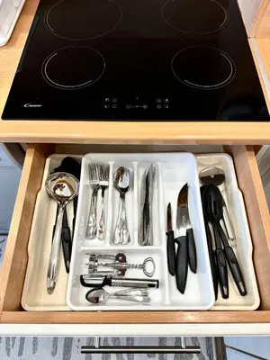 a tray of utensils in a drawer in a kitchen at Apartman Tanja in Banja Luka