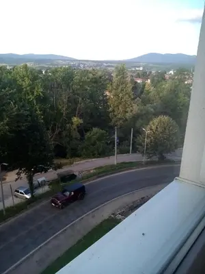 a car is driving down a street with a road at WUGE Bihac in Bihać