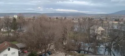 an aerial view of a city with trees and buildings at WUGE Bihac in Bihać