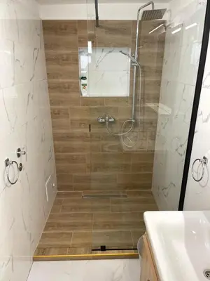 a bathroom with a shower and a sink at Studio apartman Ana in Livno