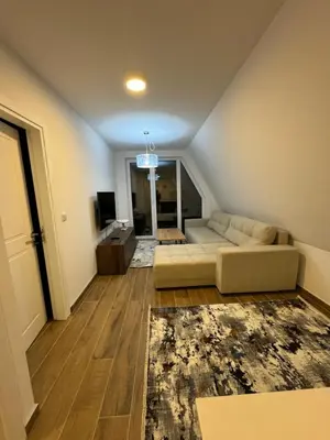 a living room with a couch and a television at Cupcake Apartments in Šišava
