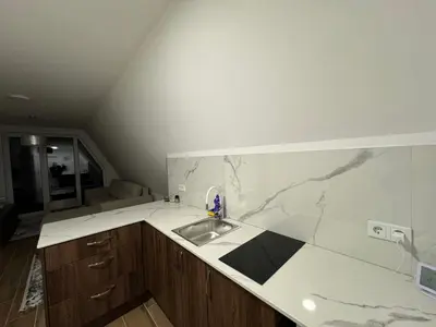 a kitchen with a sink in a room at Cupcake Apartments in Šišava