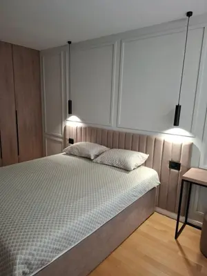a bedroom with a bed with two pillows on it at Sparkle Home in Banja Luka