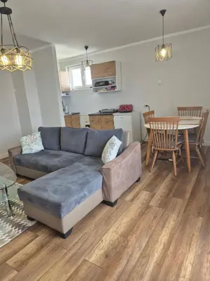 a living room with a couch and a table at Apartman Srbac in Srbac