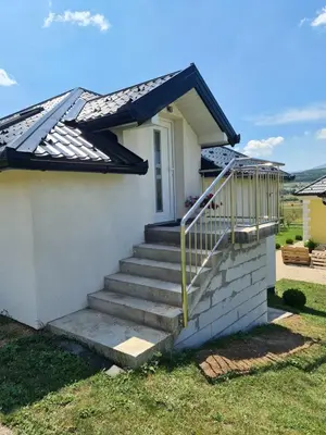 a house with stairs leading to the front door at Dora in Livno