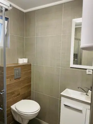 a bathroom with a toilet and a sink at Hacienda DM in Visoko