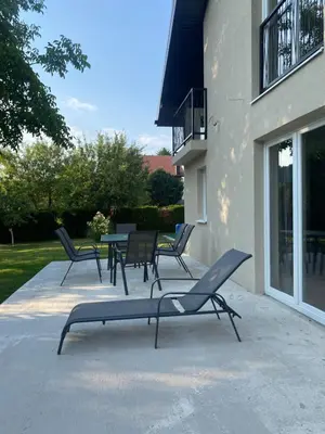 a group of chairs and a table next to a building at Hacienda DM in Visoko