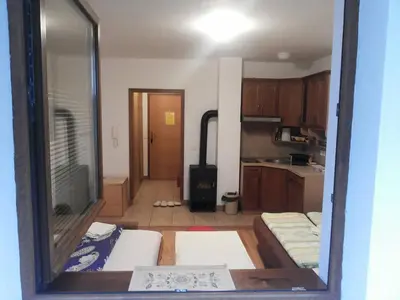 a room with a kitchen with a stove in it at Andrea & Goran 106 in Vlasic