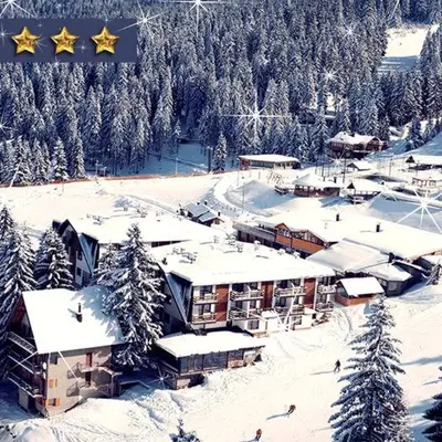 a ski resort with snow covered trees and buildings at Andrea & Goran 106 in Vlasic