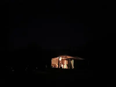 a room with a window in the dark at Kućica za odmor Srbac in Srbac