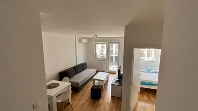 a living room with a couch and a table at Premium in Doboj
