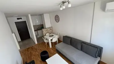 a living room with a couch and a table at Premium in Doboj