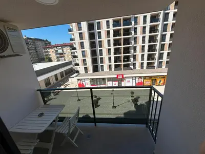 a balcony with a tennis court in a building at Premium in Doboj