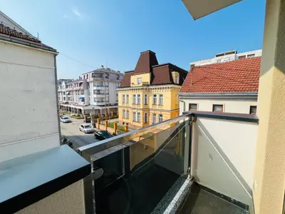 a balcony with a view of a street and buildings at Apartman Tara Lux in Banja Luka