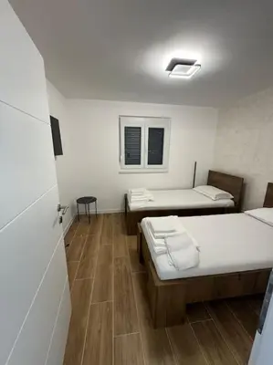 a hospital room with two beds and a window at Villa Sofia in Bihać