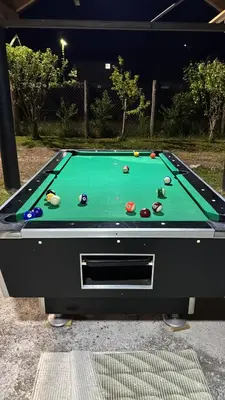a pool table with balls on top of it at Villa Sofia in Bihać