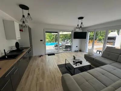 a living room with a couch and a table at Villa Sofia in Bihać