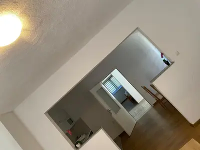 an overhead view of a living room with a stairway at Apartman Pavić in Livno