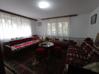 a living room with a couch and a table at Apartman Turizam Plus in Travnik