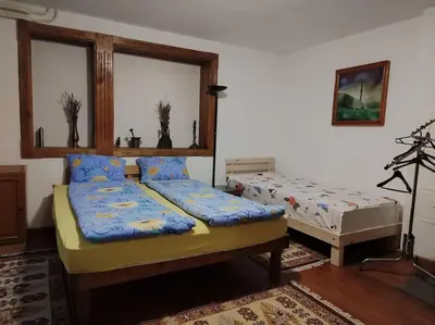 a room with two beds in a room at Apartman Turizam Plus in Travnik