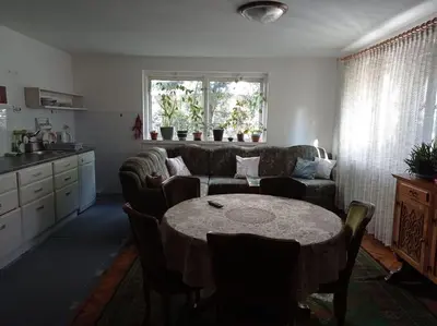 a living room with a table and a couch at Apartman Turizam Plus in Travnik