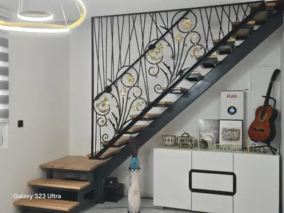 a stairway with a black and white stair railing at Natura na Uni in Bihać
