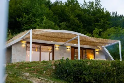 a house on top of a hill with trees at Green Sea Resort - Zeleno More in Visoko