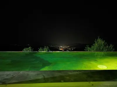 a golf course at night with a frisbee in the grass at Green Sea Resort - Zeleno More in Visoko