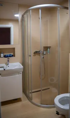 a bathroom with a shower and a toilet and a sink at Green Sea Resort - Zeleno More in Visoko