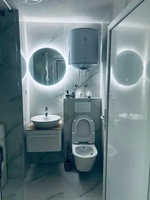 a small bathroom with a toilet and a sink at Apartman Zen in Bihać