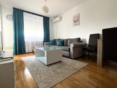 a living room with a couch and a table at stan na dan Tivana Doboj in Doboj