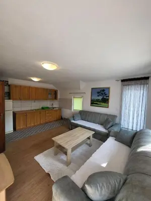 a living room with a couch and a table at Kuća za odmor PLAVA LAGUNA in Bihać
