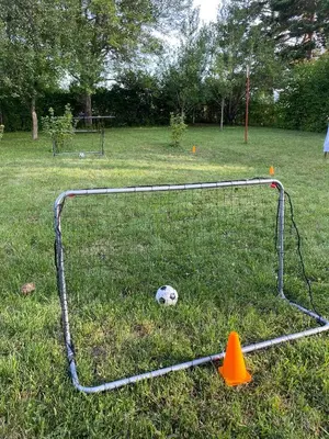 a soccer ball is in the goal of a field at Vikendica Lucija in Livno
