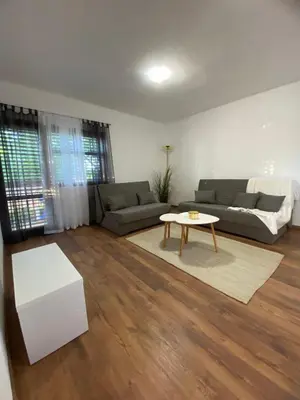 a living room with a couch and a table at Vikendica Lucija in Livno