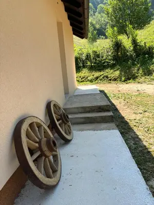 a pair of wheels on the side of a building at Ranch Jajce in Jezero