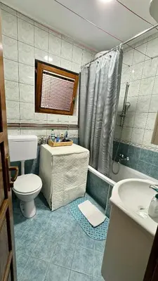 a bathroom with a sink and a toilet and a shower at Harmonija - Trn, Banjaluka in Laktaši