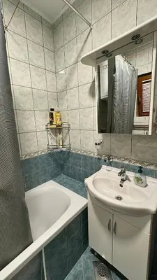 a bathroom with a sink and a bath tub at Harmonija - Trn, Banjaluka in Laktaši