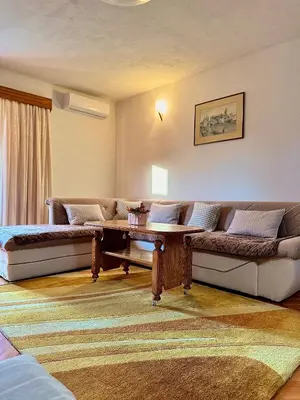 a living room with a couch and a table at Harmonija - Trn, Banjaluka in Laktaši