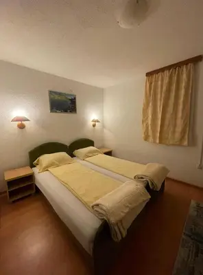 a bedroom with a large bed in a room at Apartmani Centar Fojnica in Fojnica
